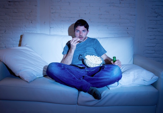 TV Night Popcorn Sofa iStock/OcusFocus